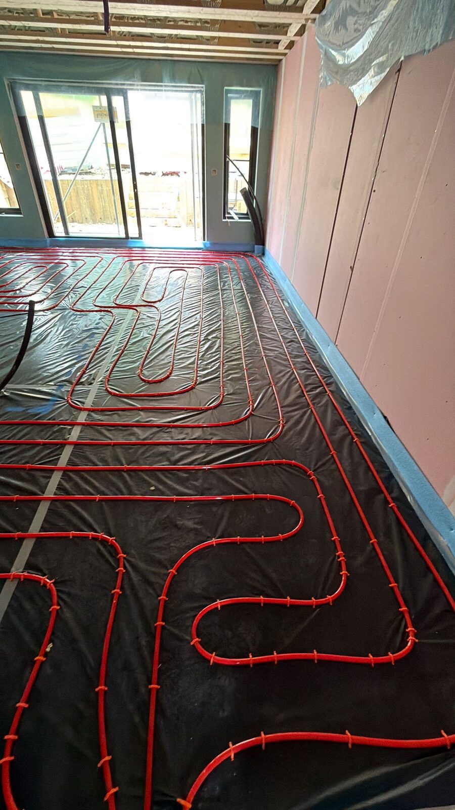 Dense, evenly spaced wet underfloor heating pipe coverage in a London home