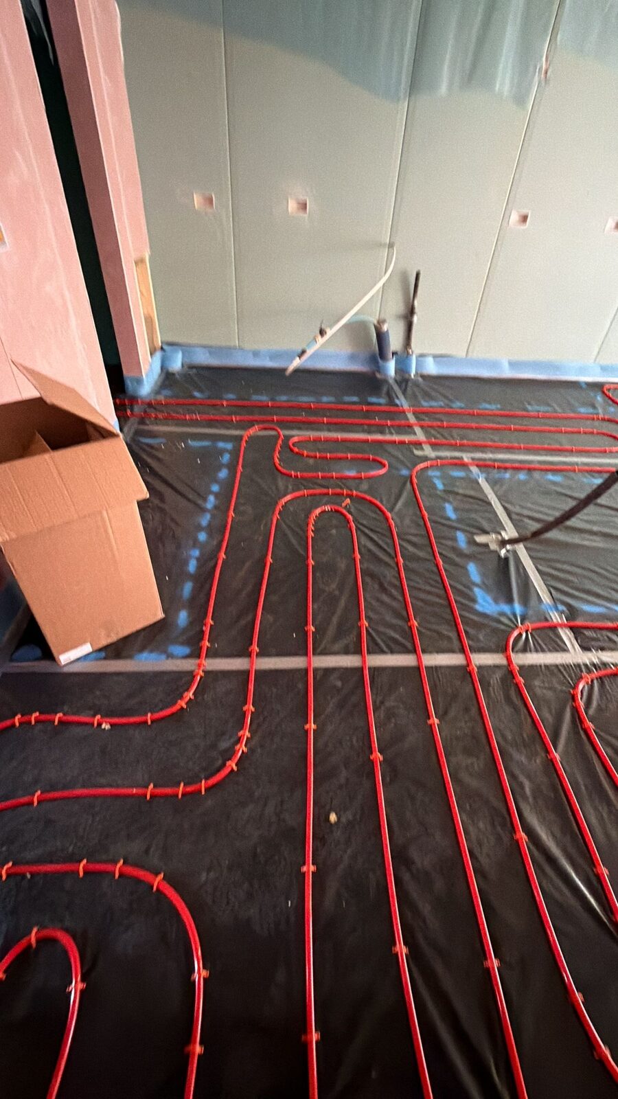 Low-profile wet underfloor heating loops fitted during a London retrofit