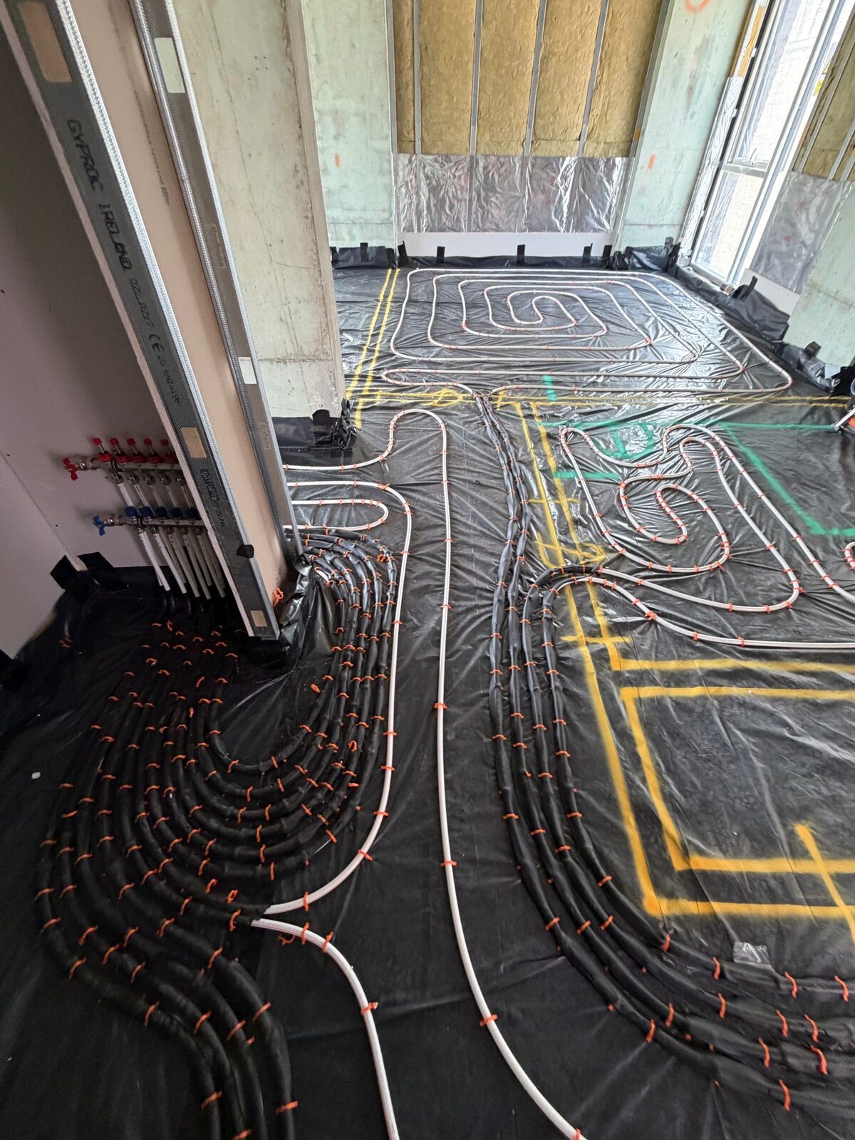 Underfloor heating manifold connections during an Islington period terrace installation