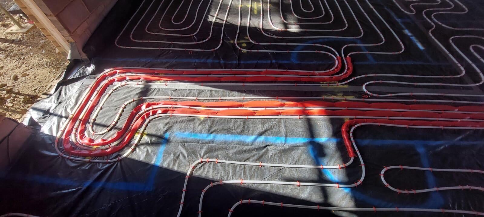 Wet underfloor heating installed across a bright London extension before screeding